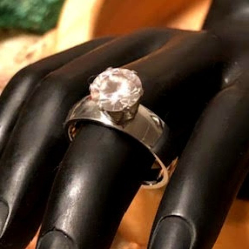 Large Round Rhinestone in raised setting on a solid silver tone band